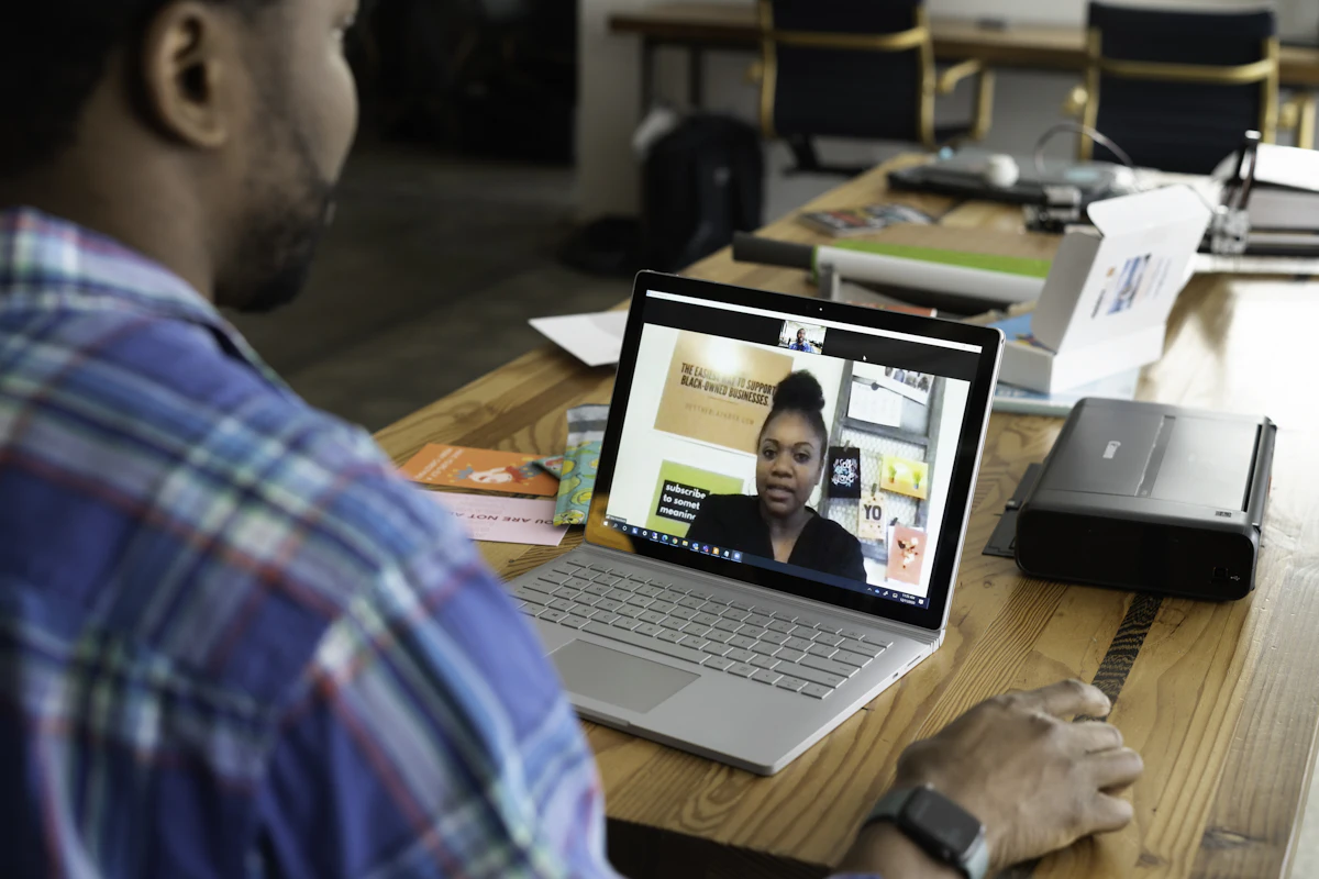 Man joining a video meeting on his laptop